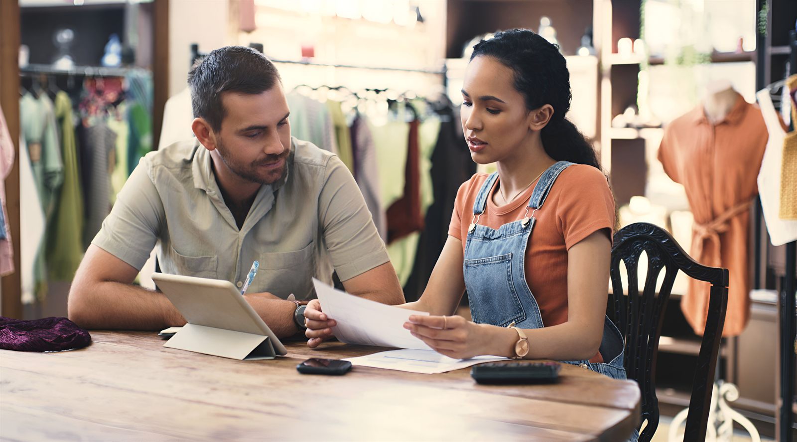 A business owner going through unpaid customer invoices