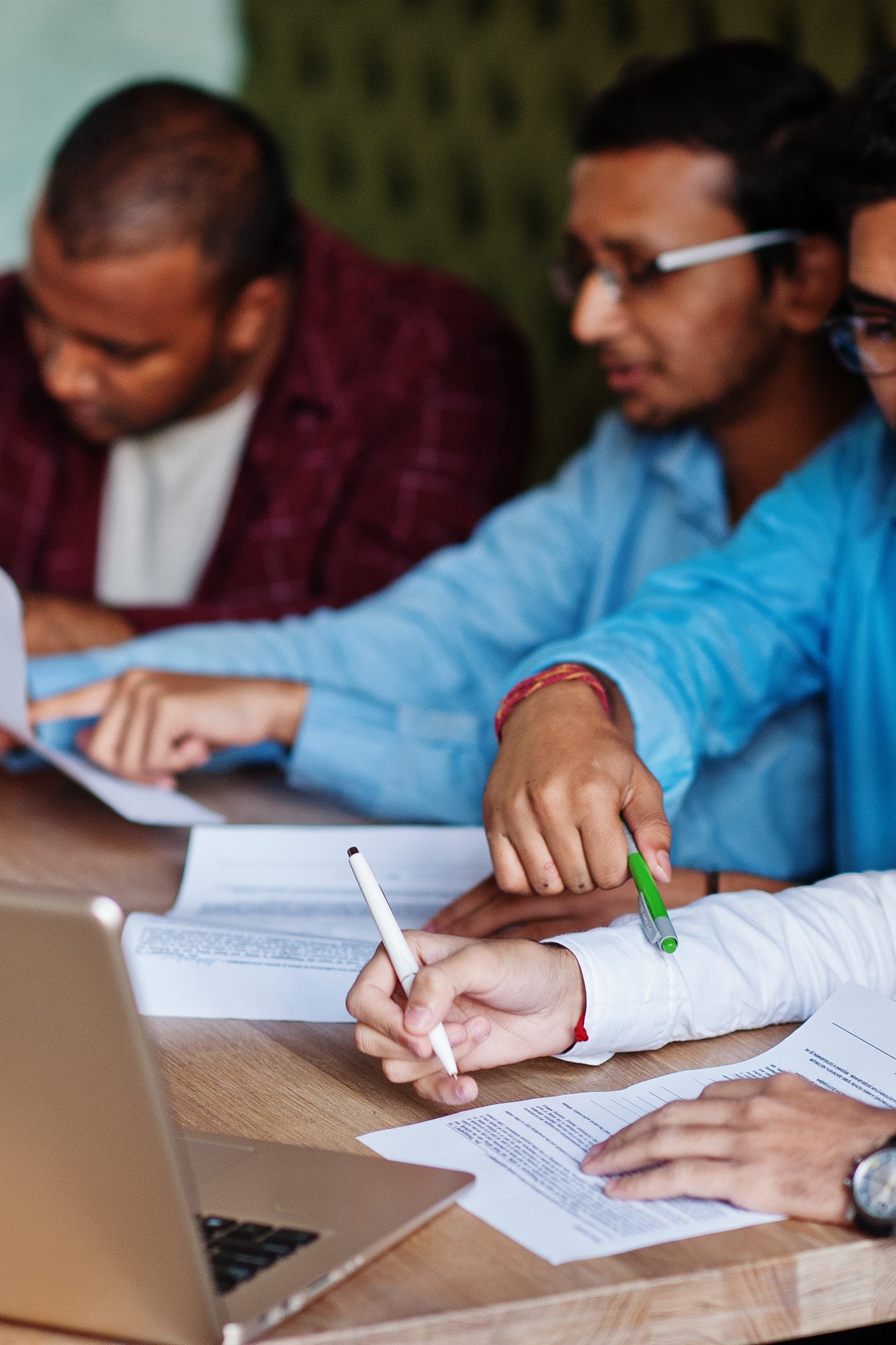 The Capnix team collaborating over project documents
