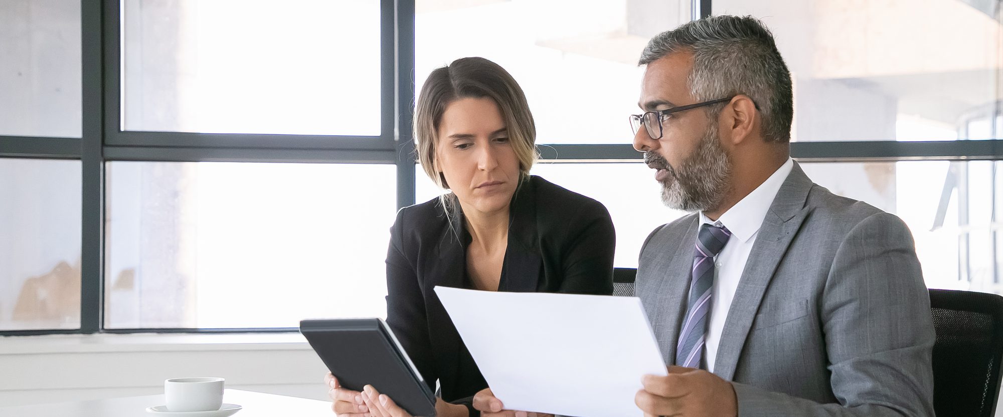 An advisor and a client reviewing a document together